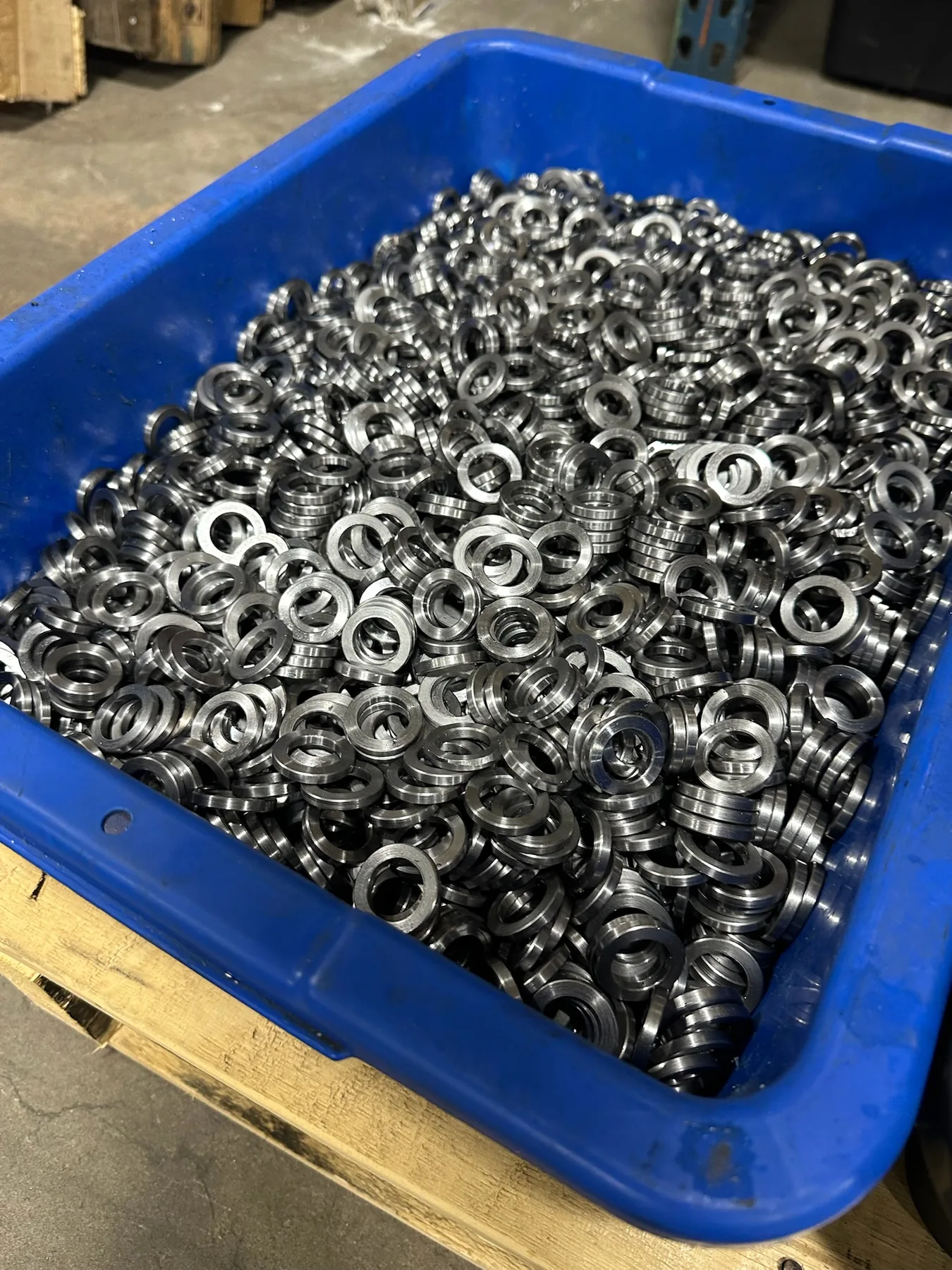 Machined component bin and tooling detail for CNC machining support.