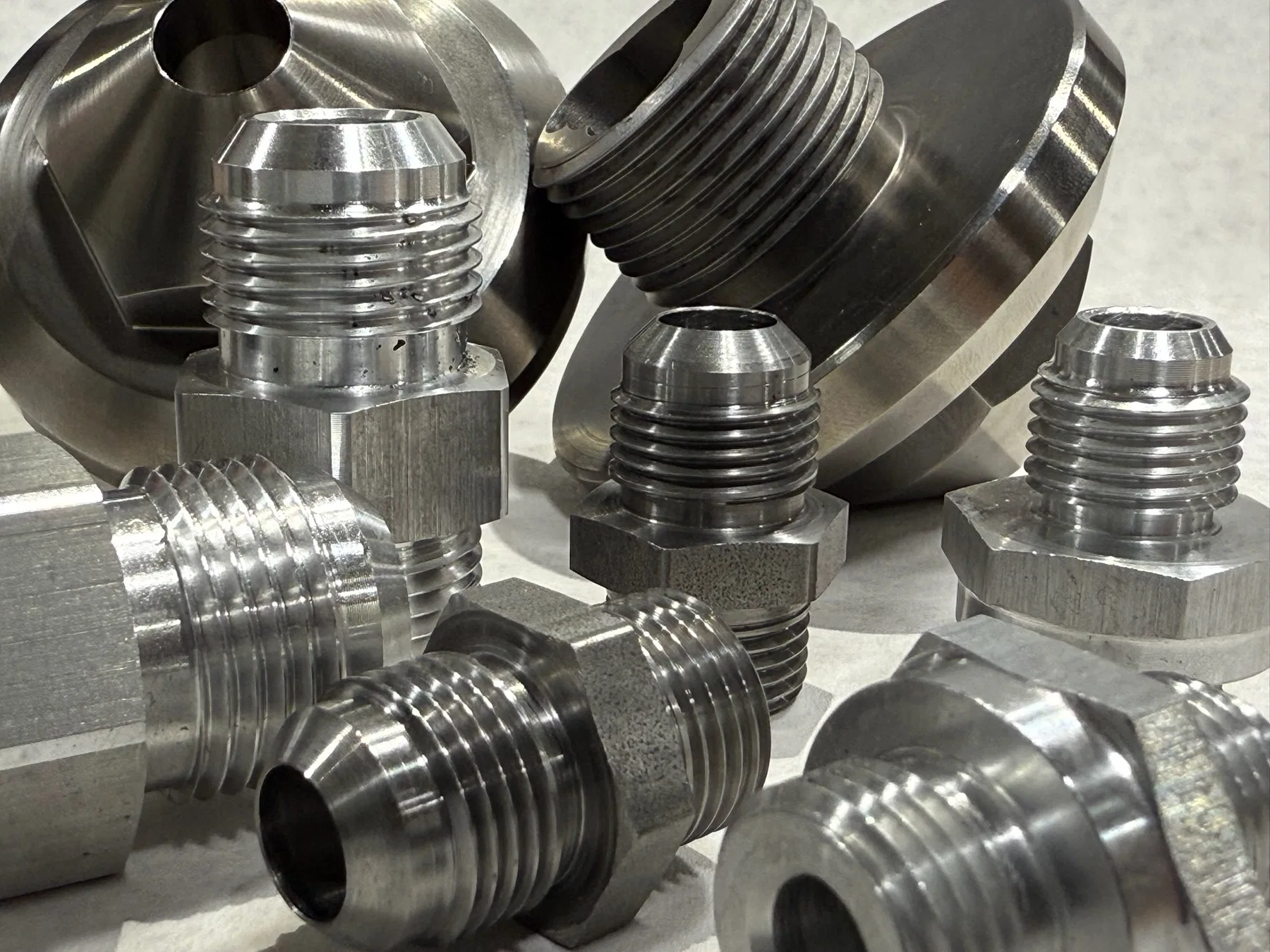 Close-up group of finished CNC machined components.