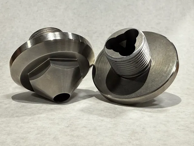 CNC turned ring components with polished faces.