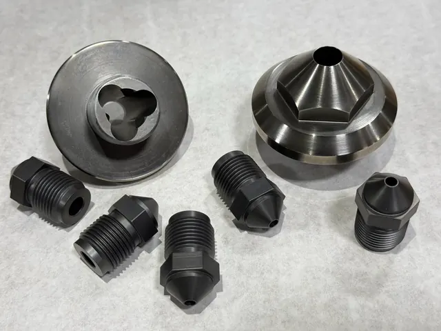 Mixed CNC machined fittings and components.