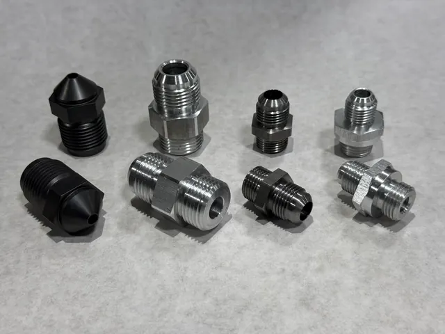 Mixed black and silver machined fittings.