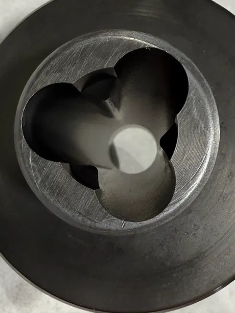 Machined internal feature in a round component.
